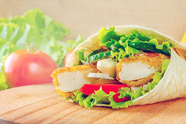 Chicken wrap with lettuce and tomatoes